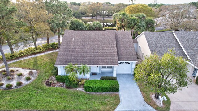 view of front of home with a garage and a front yard