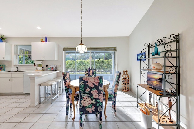 dining space featuring light tile patterned floors