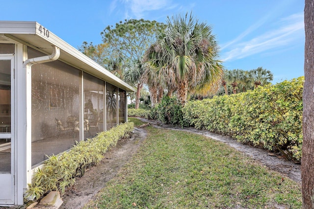 view of yard with a sunroom