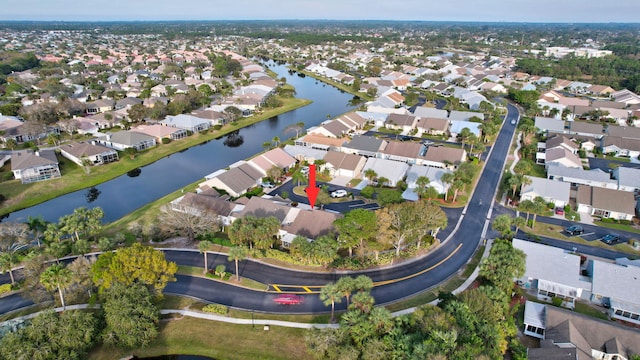 bird's eye view with a residential view and a water view