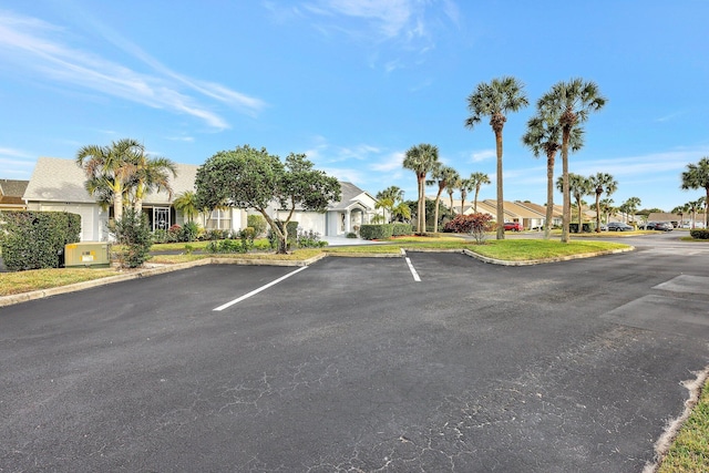 uncovered parking lot with a residential view