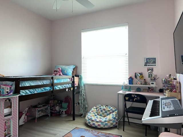 bedroom featuring ceiling fan and light hardwood / wood-style flooring