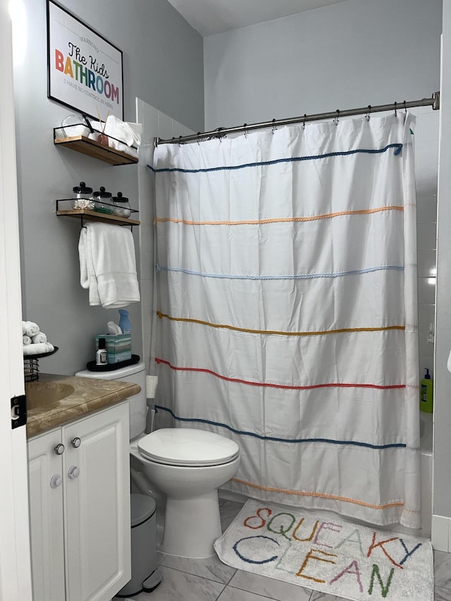 full bathroom with vanity, toilet, and shower / bath combo