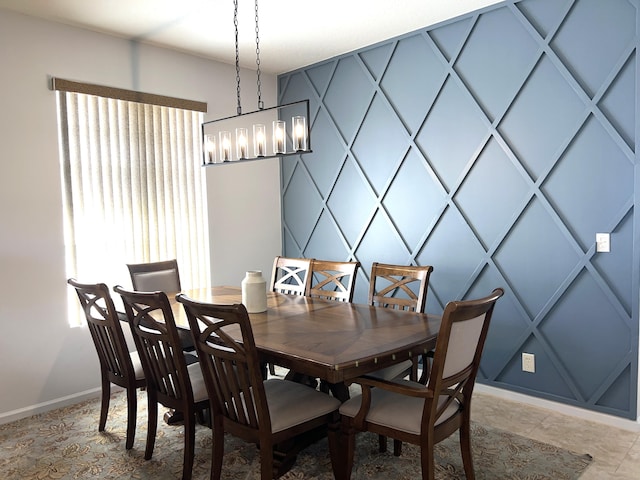 dining space featuring an inviting chandelier