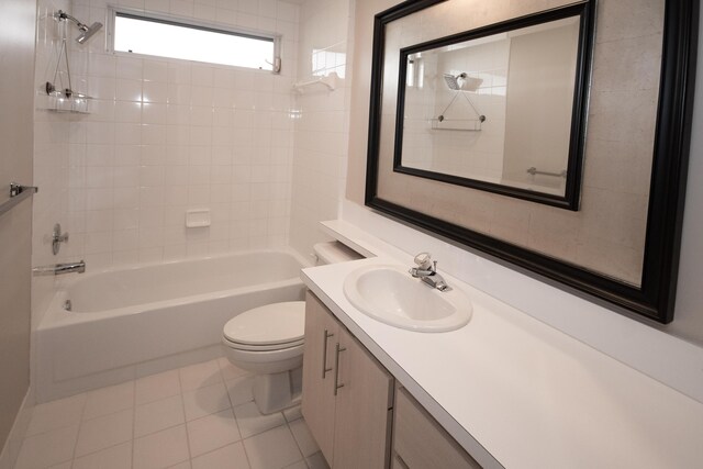 full bathroom with vanity, tile patterned floors, toilet, and tiled shower / bath