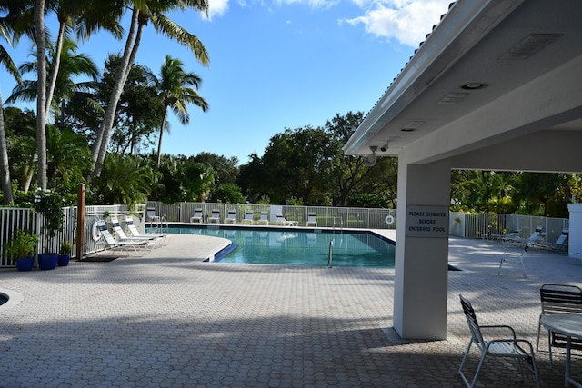 view of swimming pool featuring a patio area