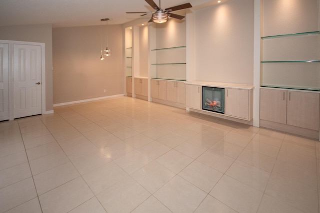 unfurnished living room with light tile patterned floors, ceiling fan, and built in shelves