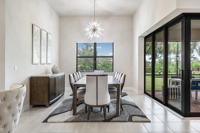 dining area featuring an inviting chandelier, a healthy amount of sunlight, and light tile patterned flooring