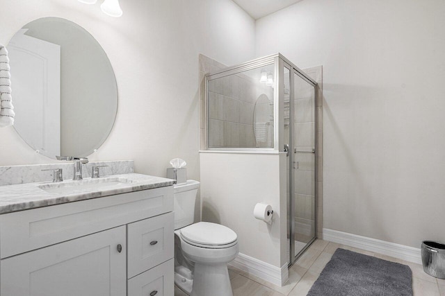 bathroom with walk in shower, tile patterned floors, vanity, and toilet