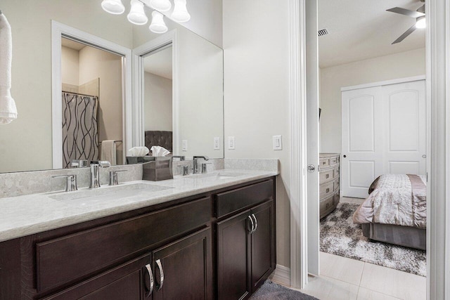 bathroom featuring ceiling fan, tile patterned floors, and vanity