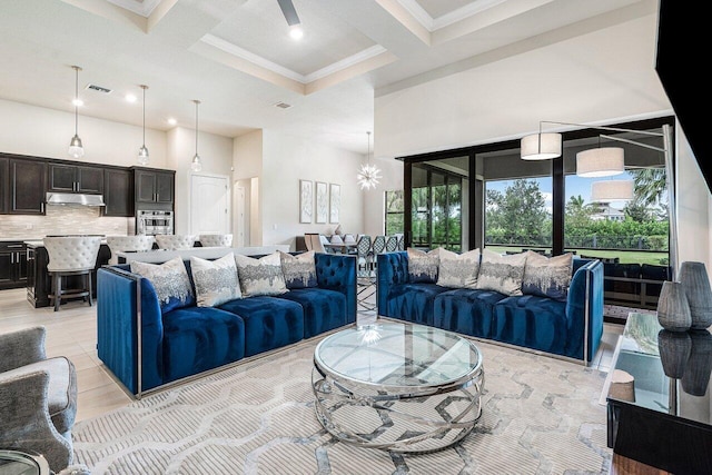 living room with coffered ceiling, crown molding, beamed ceiling, and a high ceiling