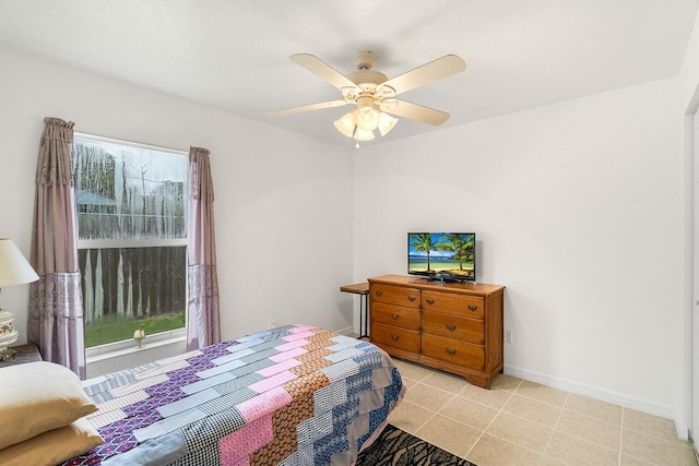 tiled bedroom with ceiling fan