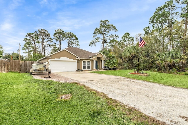 view of front of house with a garage and a front yard