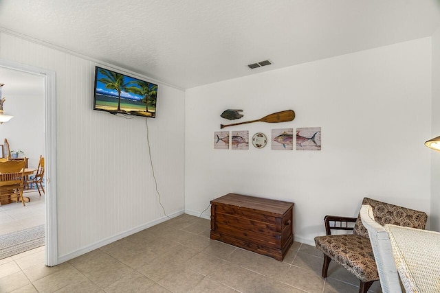 sitting room featuring a textured ceiling