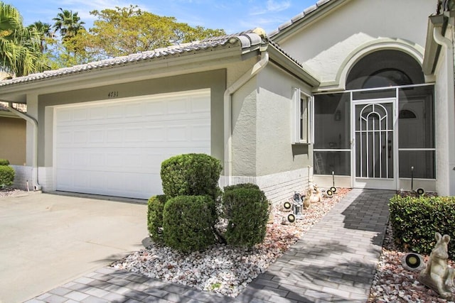 property entrance with a garage