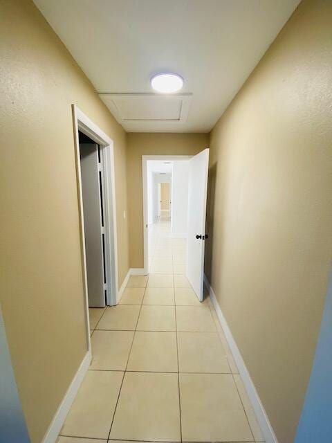 hallway with light tile patterned floors