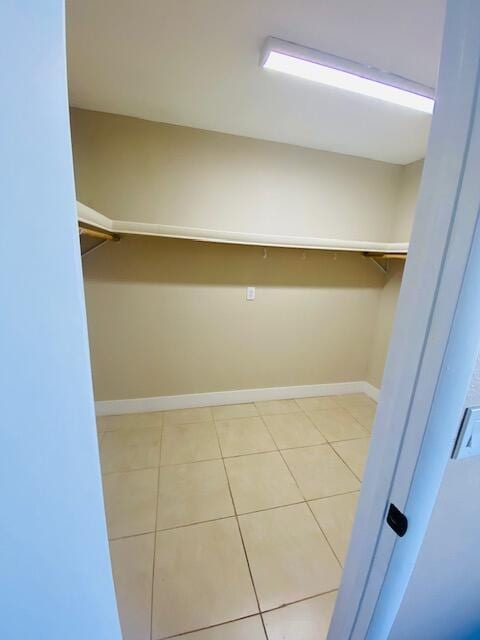 walk in closet featuring light tile patterned floors