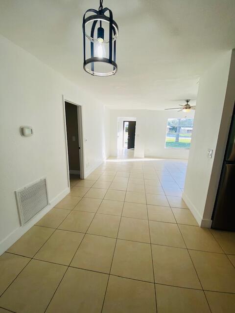 interior space with light tile patterned floors