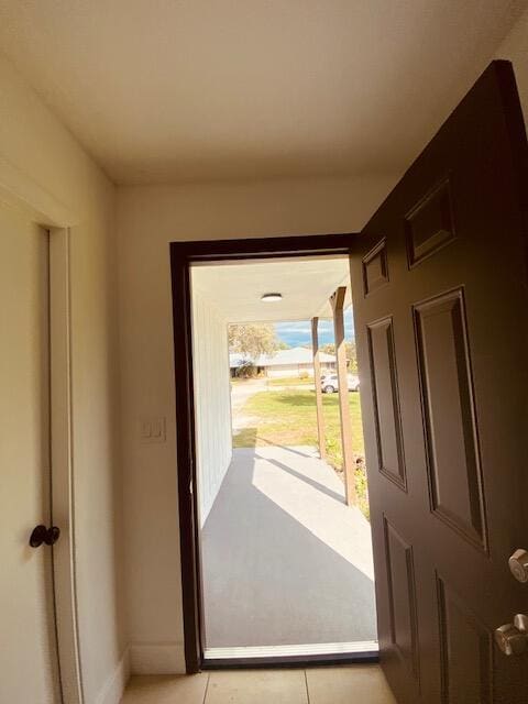 entryway with light tile patterned floors