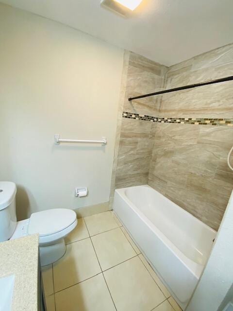 full bathroom with vanity, toilet, tiled shower / bath combo, and tile patterned flooring