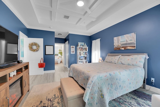 bedroom featuring beamed ceiling, crown molding, coffered ceiling, and light wood-type flooring