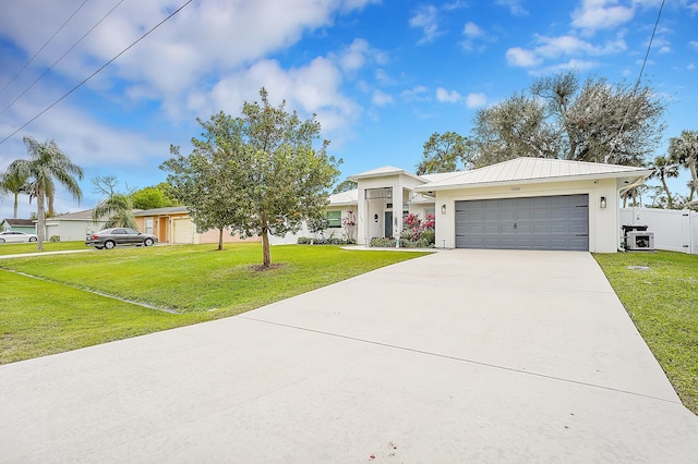 ranch-style house featuring a garage and a front yard