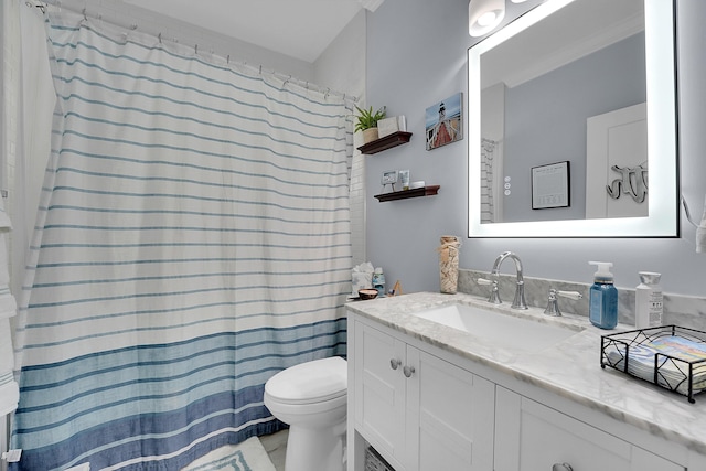 bathroom with vanity, toilet, and walk in shower