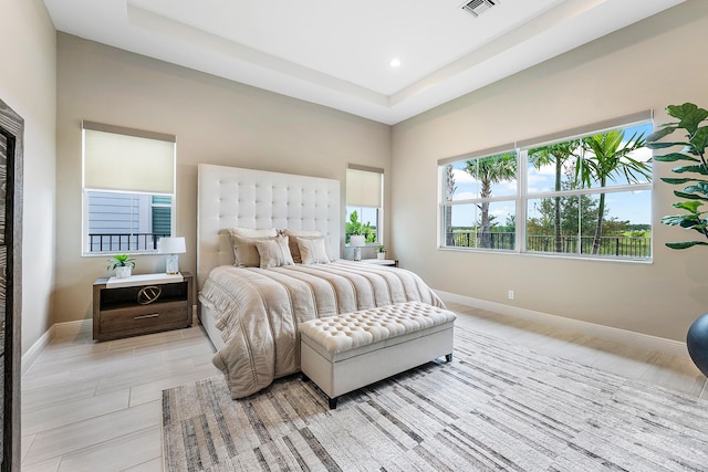 bedroom with a raised ceiling