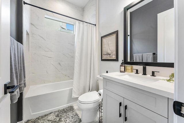 full bathroom featuring vanity, shower / bath combination with curtain, and toilet