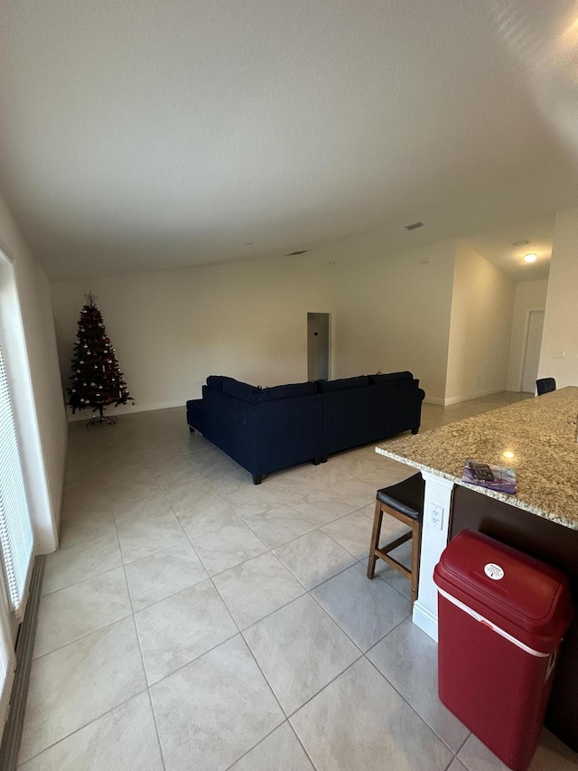 living room featuring light tile patterned flooring