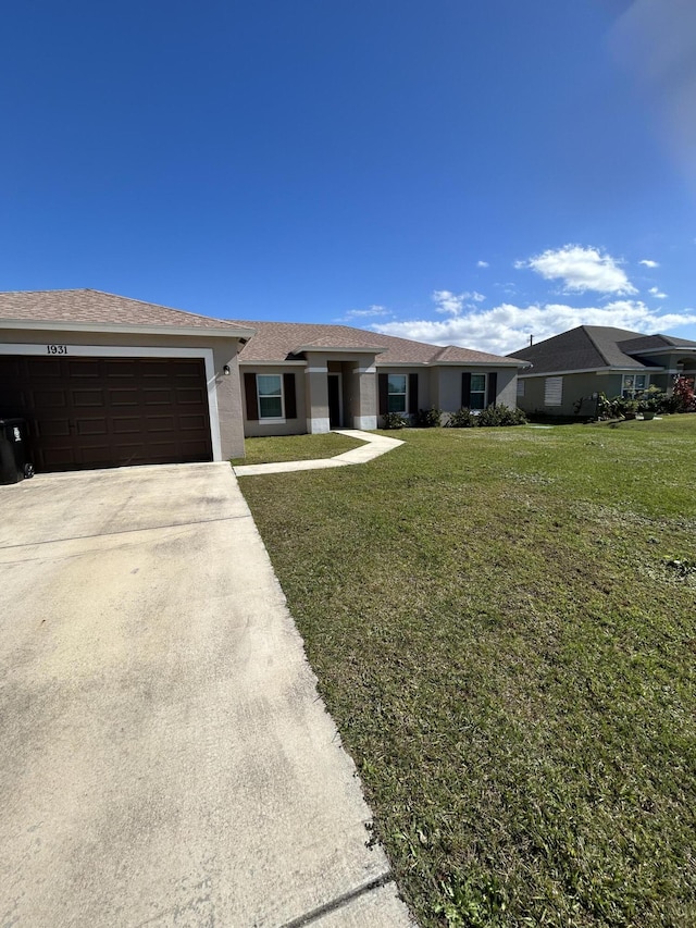 ranch-style house featuring a garage and a front yard