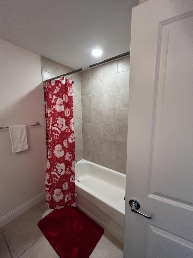 bathroom featuring tile patterned flooring and shower / bathtub combination with curtain