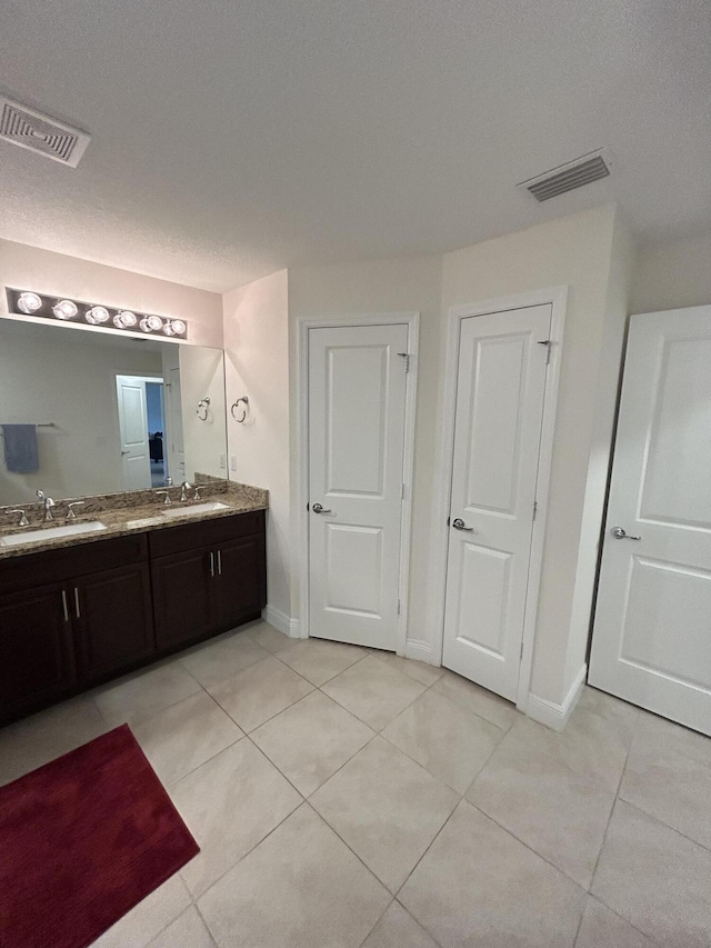 bathroom featuring vanity and tile patterned flooring