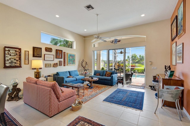 living room with ceiling fan and light tile patterned floors