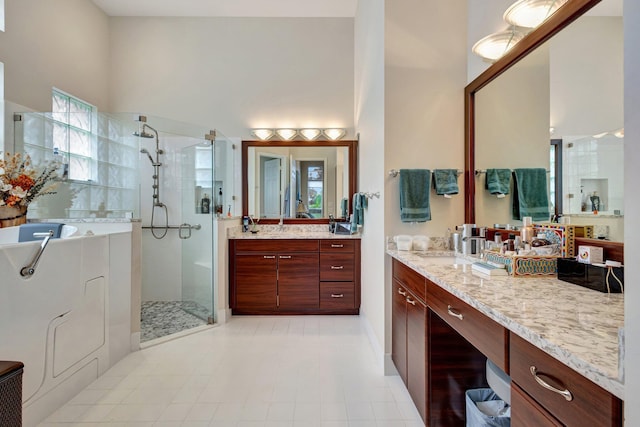 bathroom with vanity, an enclosed shower, and a high ceiling