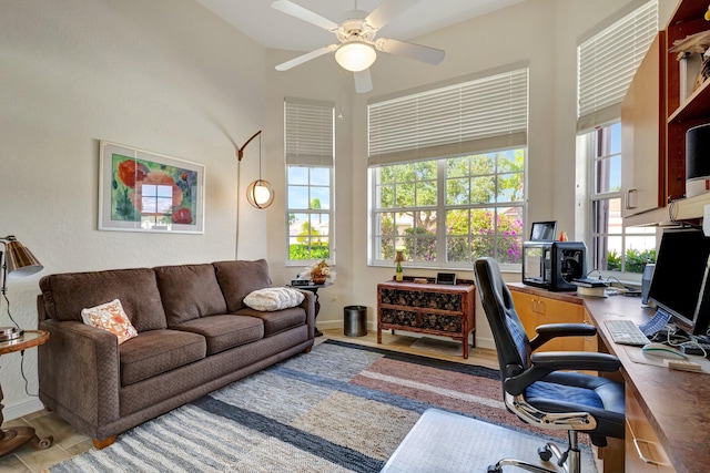 office space featuring wood-type flooring, ceiling fan, and plenty of natural light