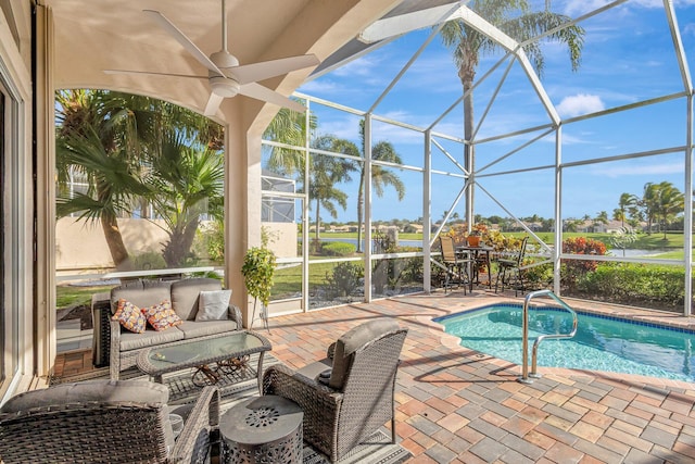 view of swimming pool featuring a patio and glass enclosure