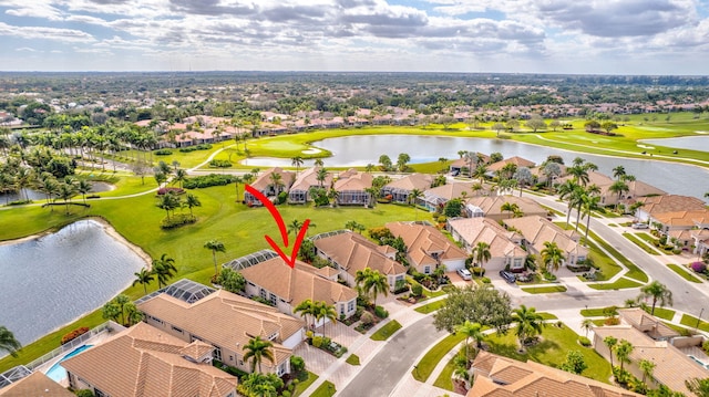 birds eye view of property featuring a water view