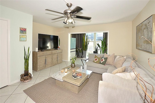 tiled living room with ceiling fan