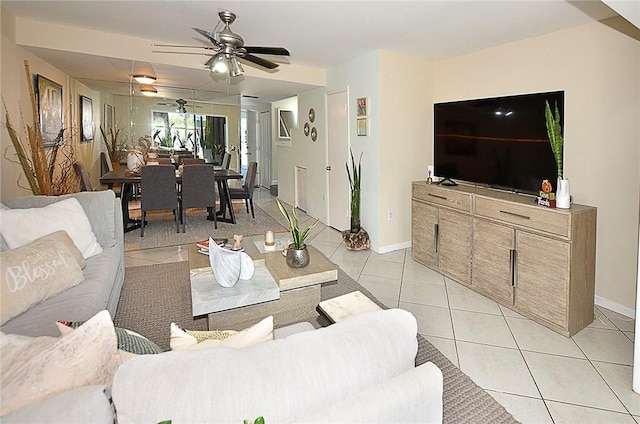 living room featuring ceiling fan and light tile patterned floors