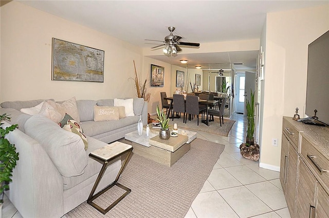 living room featuring light tile patterned floors and ceiling fan