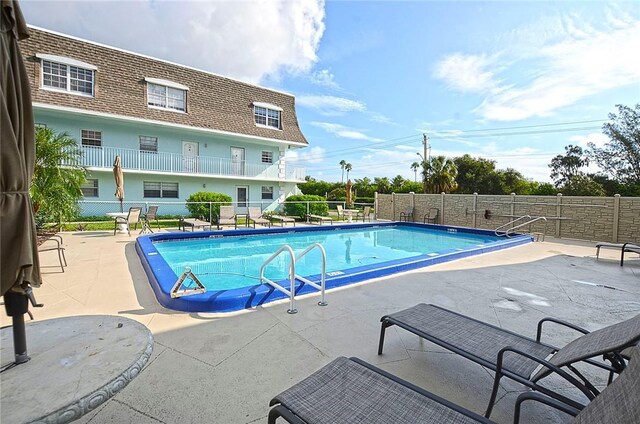 view of swimming pool featuring a patio