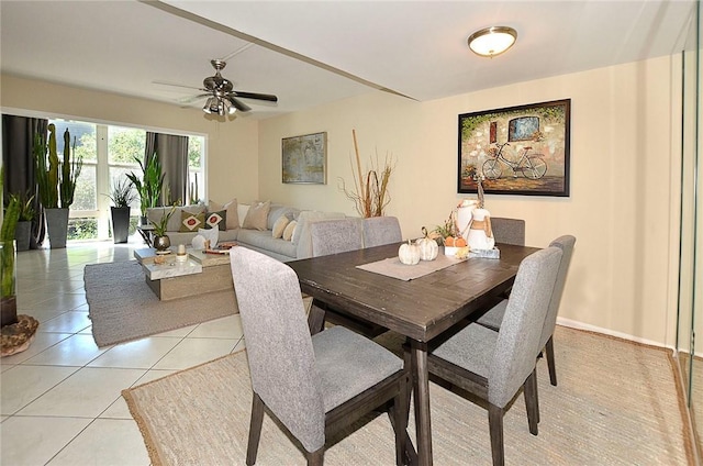 tiled dining room with ceiling fan