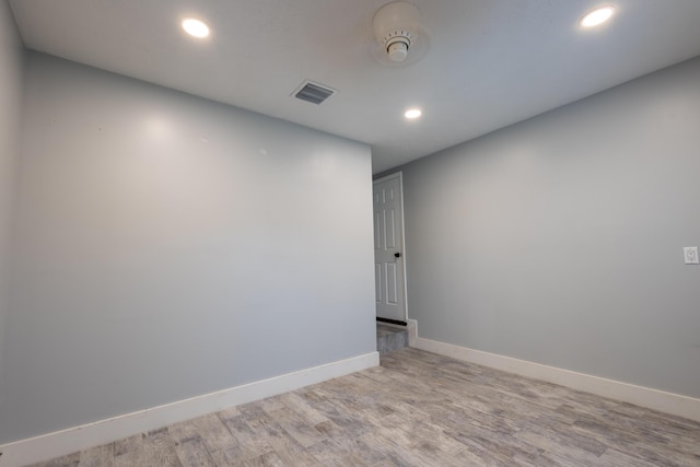 empty room with light hardwood / wood-style floors