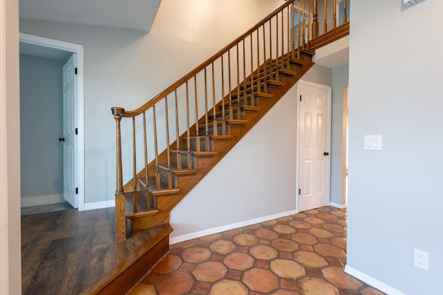 stairs with lofted ceiling