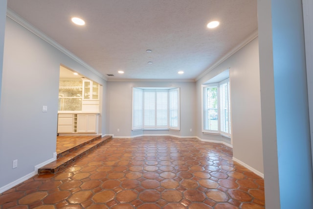 unfurnished living room featuring ornamental molding