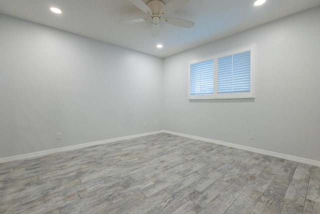 empty room featuring ceiling fan and light wood-type flooring