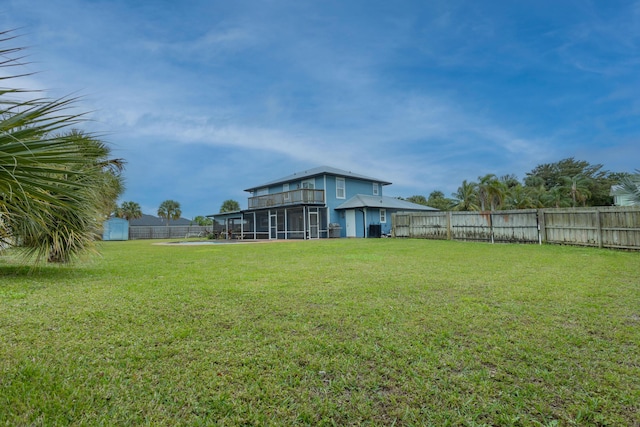 view of yard featuring a sunroom