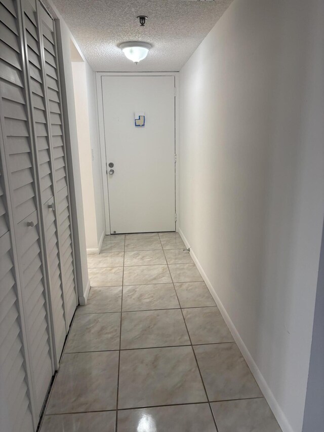 spare room with ceiling fan, dark hardwood / wood-style floors, and a textured ceiling