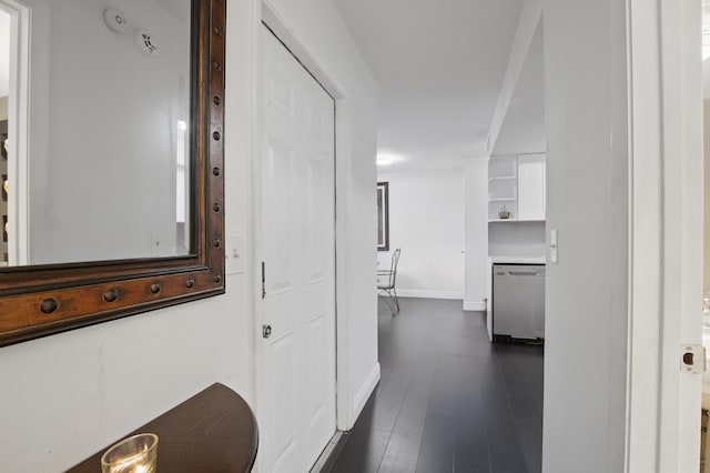 hall with dark wood-type flooring